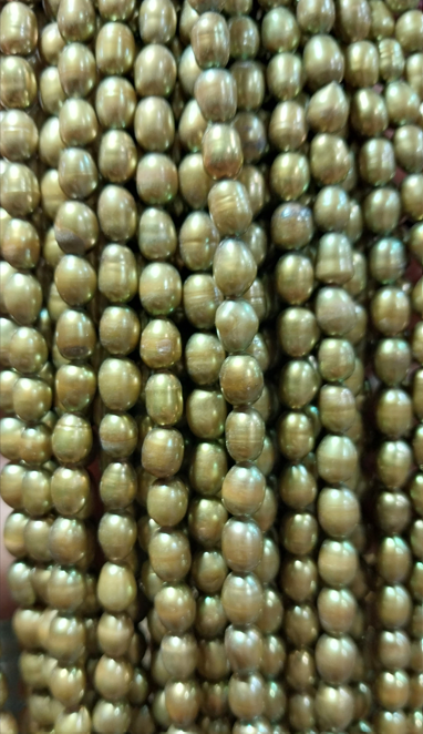 Freshwater Pearls rice beads green 6x5mm