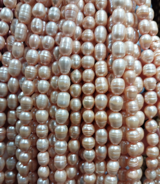 Freshwater Pearls rice beads peach 7x6mm