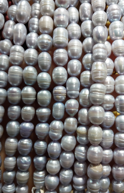 Freshwater Pearls rice beads white with blue detail 10x6mm