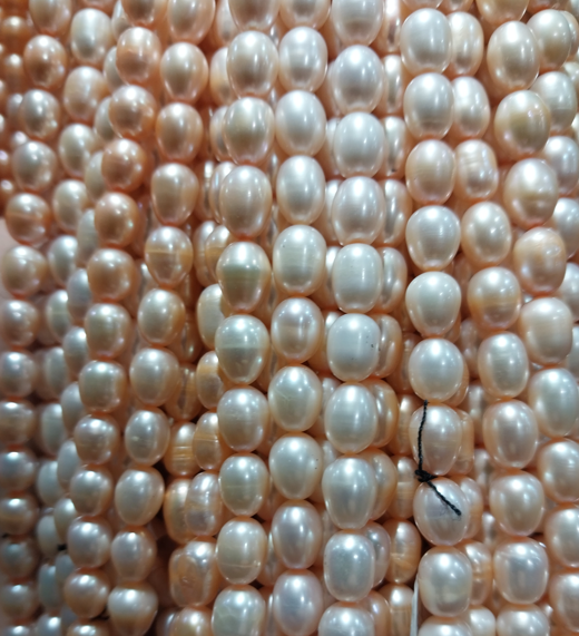 Freshwater Pearls rice beads white with orange detail 7x6mm